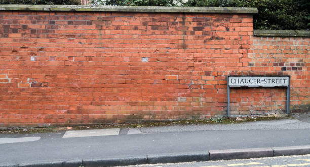 istock Street Sign Against Brick Wall 973432020