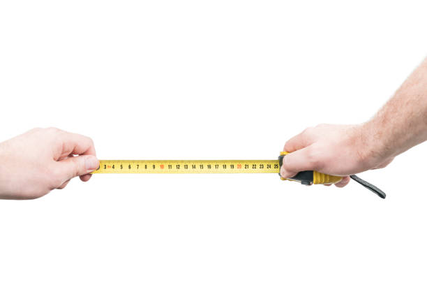 istock Man hands with a tape measure 973434956