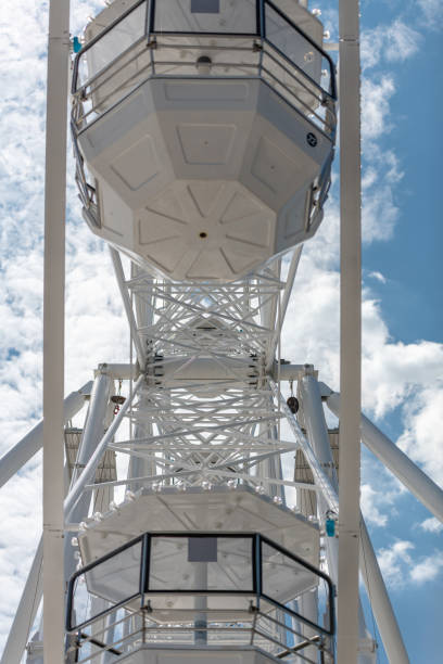 istock Detail of gondolas on a large white ferris wheel 973442704