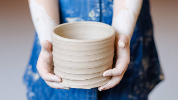 istock pottery handcraft hobby hands shape clay wheel 973442868