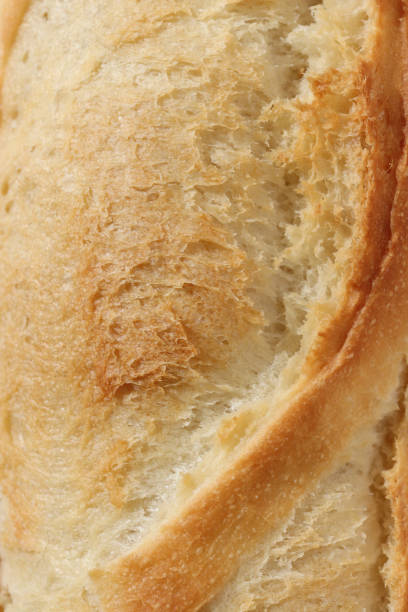 istock Baguette Texture. Crust of Bread Food Background. Macro Closeup. 973446150