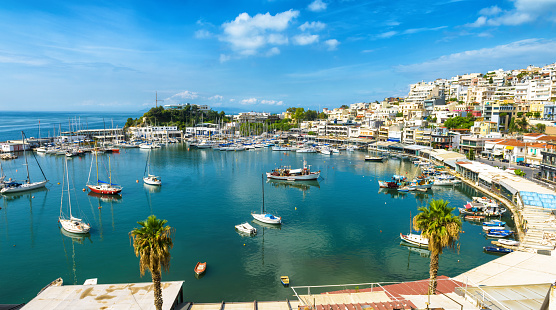 Mikrolimano marina in Piraeus, Athens, Greece. Panoramic view of the beautiful harbor with sail boats. Scenery of the city coast with scenic sea port. Luxury marine relax on the waterfront of Athens.