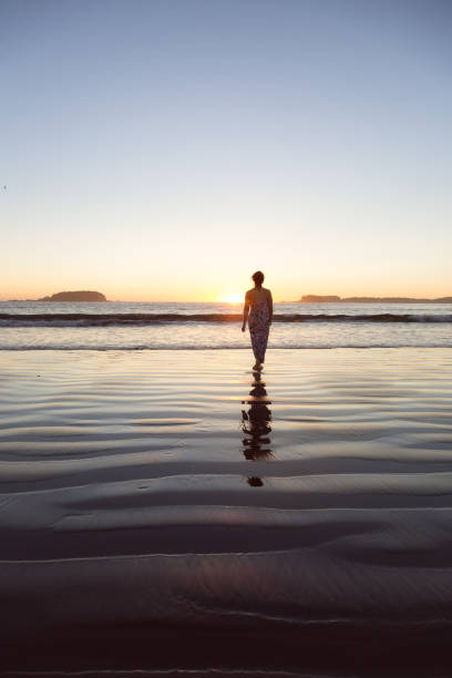 istock Woman on a sandy beach 973448928