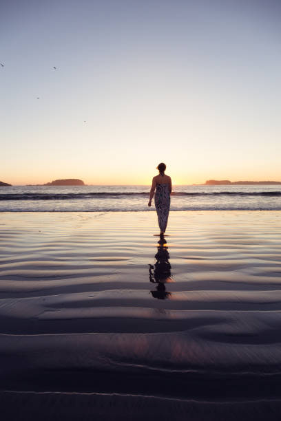 istock Woman on a sandy beach 973448930
