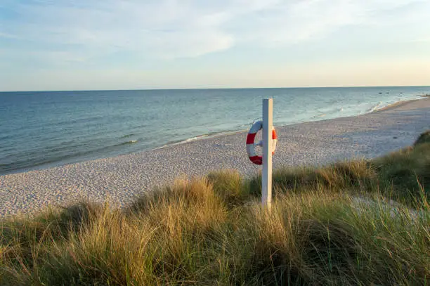 Beach with live saver/ belt in evening light