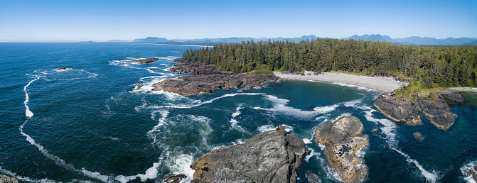Aerial panorama of the beautiful coast during a sunny morning. Taken near Tofino, Vancouver Island, British Columbia, Canada.