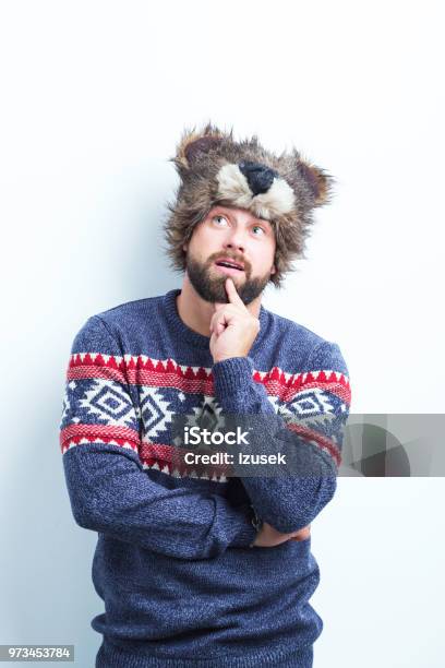 Thoughtful Man In Warm Clothing Stock Photo - Download Image Now - Fashion Model, Males, Studio Shot