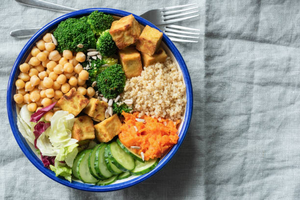 istock Salad bowl with quinoa, tofu, chickpeas and vegetables 973457334