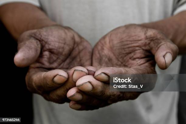 The Poor Old Mans Hands Beg You For Help The Concept Of Hunger Or Poverty Selective Focus Poverty In Retirement Alms Stock Photo - Download Image Now