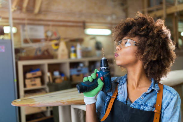 istock Young woman doing woodwork in a workshop 973470764