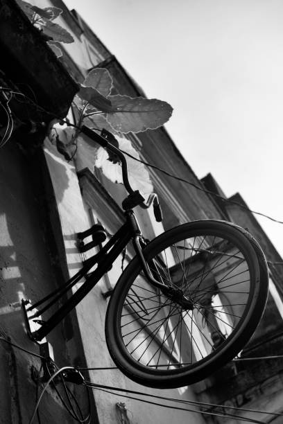 Detail of a bicycle hanging in an old commercial building in the historical center of the city of Santos on the southeastern coast of Brazil