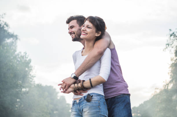 istock Young couple having fun on the beach 973478232