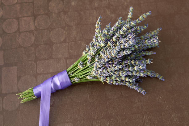 istock Lavender bouquet on a brown background 973478492