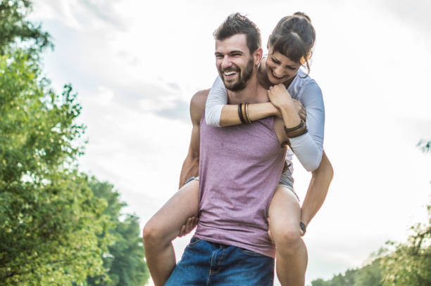 istock Young couple having fun on the beach 973478528