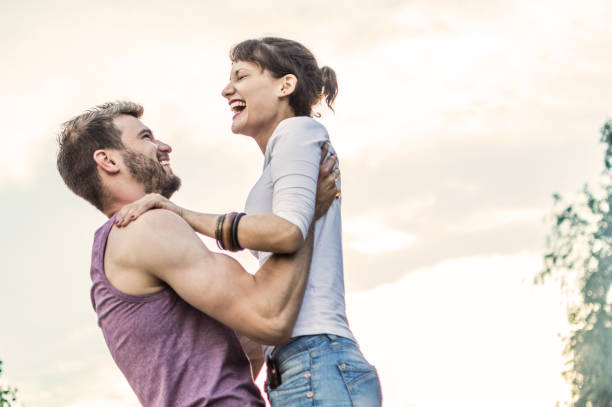istock Young couple having fun on the beach 973478576