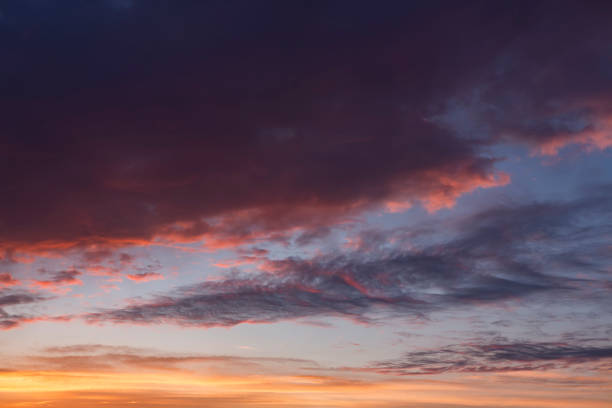 istock Colorful clouds on evening sky at sunset background. 973480990