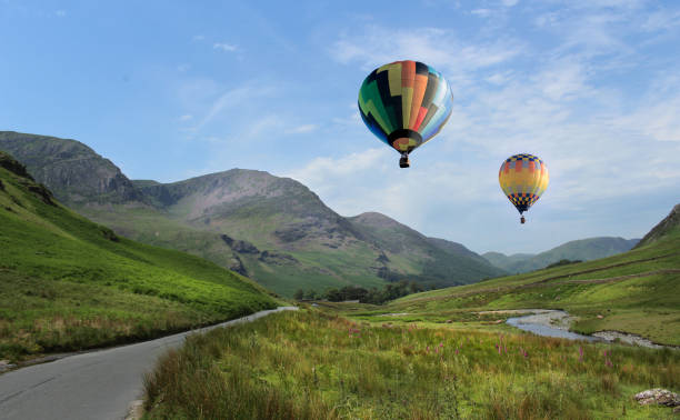 istock Hot Air Balloons Float Over The Lake District 973484726