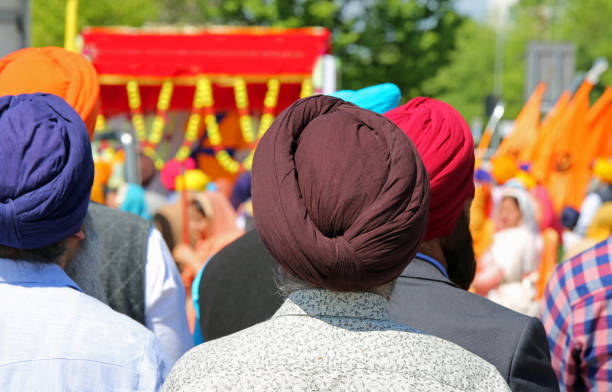 istock sikh men with turbans on head during a religious ceremony. the t 973485382