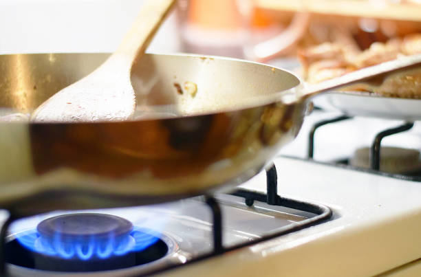 istock Spatula stirring food in saute pan 973487798