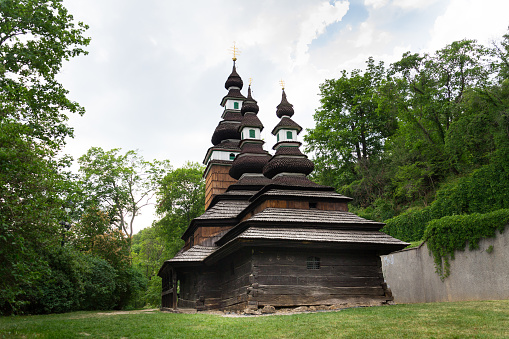 Wooden orthodox Carpathian Ruthenian Church of the Saint Michael Archangel at Kinsky Gardens, Petrin, Czech Republic, typical folk wooden log building with shingled roof was moved from Subcarpathian Russia, today Zakarpati in Ukraine, and built again in Prague in 1929