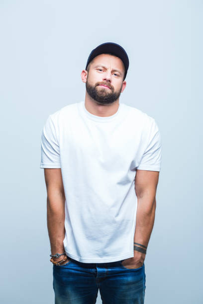 istock Young man standing with hands in pocket 973488064