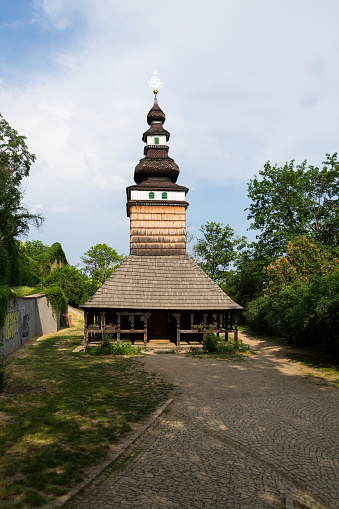 Wooden orthodox Carpathian Ruthenian Church of the Saint Michael Archangel at Kinsky Gardens, Petrin, Czech Republic, typical folk wooden log building with shingled roof was moved from Subcarpathian Russia, today Zakarpati in Ukraine, and built again in Prague in 1929