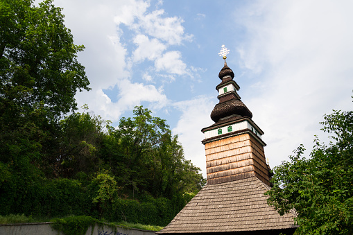 Wooden orthodox Carpathian Ruthenian Church of the Saint Michael Archangel at Kinsky Gardens, Petrin, Czech Republic, typical folk wooden log building with shingled roof was moved from Subcarpathian Russia, today Zakarpati in Ukraine, and built again in Prague in 1929