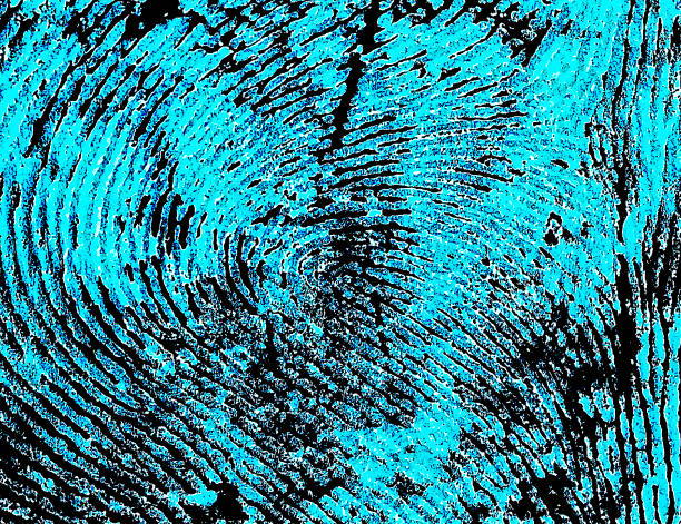 istock Fingerprint with ultraviolet lamp. Fingerprint as background. 973489614