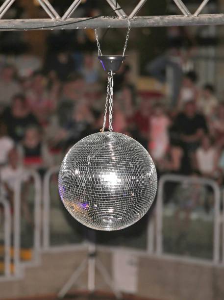 istock Big disco ball at the concert that reflects light 973492008