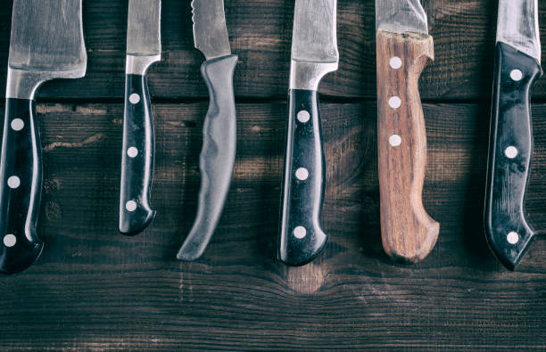 istock various knives on a brown wooden board 973501134