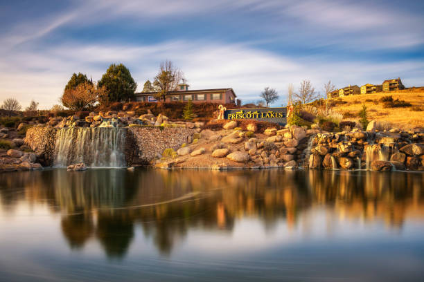 Prescott, Arizona, USA - January 2, 2018 : Prescott Lakes sign with an artificial waterfall. Prescott Lakes is a residential and golf community located in the city of Prescott. Long exposure.