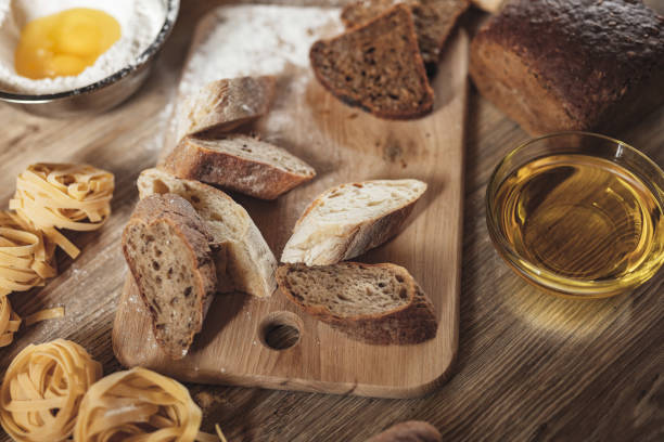 istock preparation recipe bread, pizza, spaghetti making ingridients, food flat lay on kitchen table background. 973508378