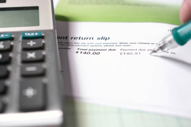 istock Working on home financial  accounts a utility bill 973512388