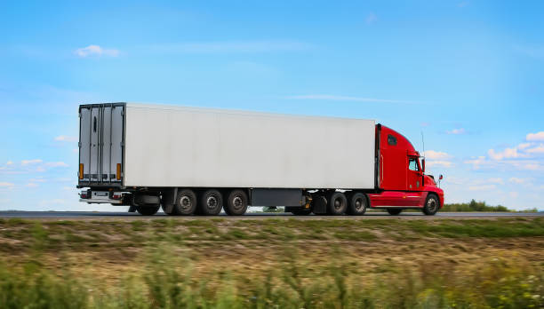 istock trailer with red cabin goes on the highway 973531722