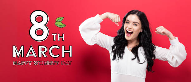 istock Womens Day message with powerful woman 973534290