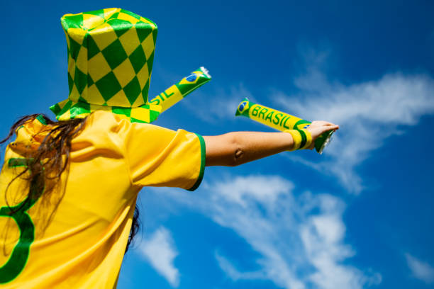 istock Brazilian fan playing with baton 973546810
