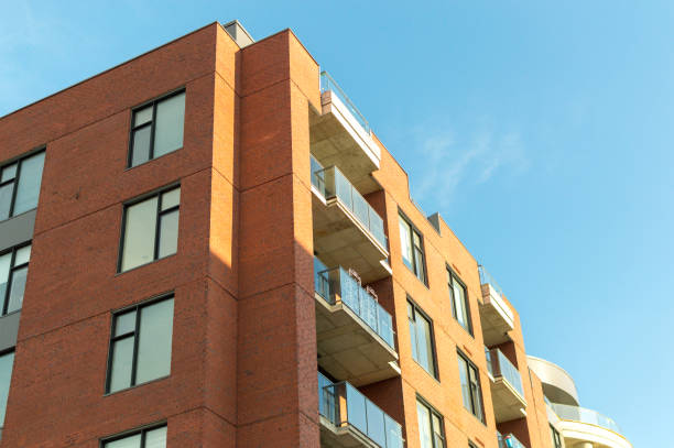 istock Modern condo buildings with huge windows and balconies 973549992