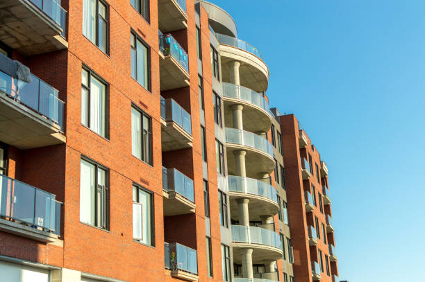 istock Modern condo buildings with huge windows and balconies 973550092