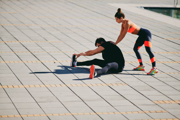 istock Man working out with personal trainer. 973564858