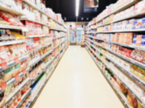 istock supermarket aisle interior blurred background 973570904