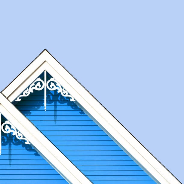 Detail of the gingerbread style fretwork of the typical wooden houses of Iles de la Madeleine, or the Magdalen Islands, in Canada. Minimalistic style in blue tones with space for text.