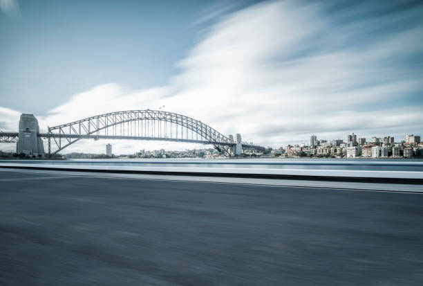 istock blurred motion road in Sydney with Sydney Harbor Bridge on background 973593758