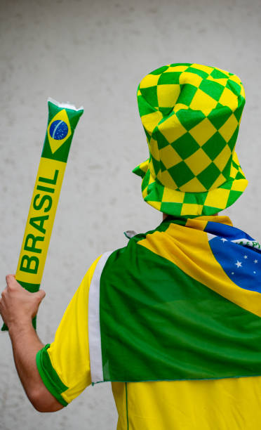 istock Brazilian fan playing with baton 973618970