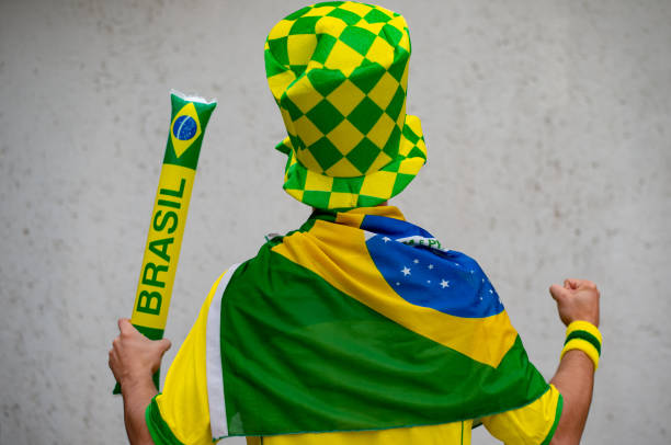 istock Brazilian fan playing with baton 973619112