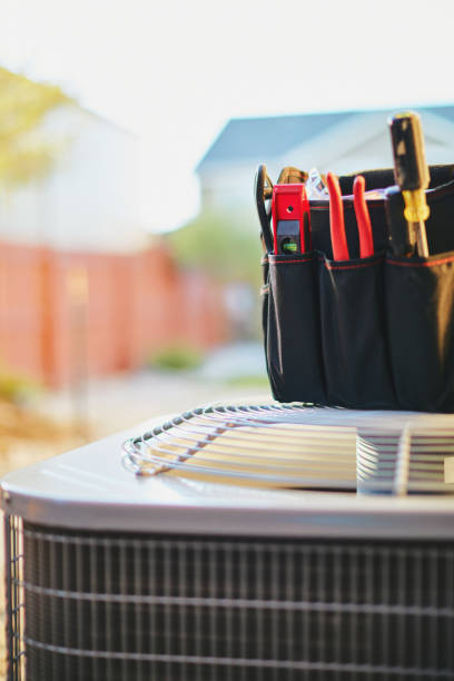 istock Air conditioner with maintenance tools in residential back yard 973631528