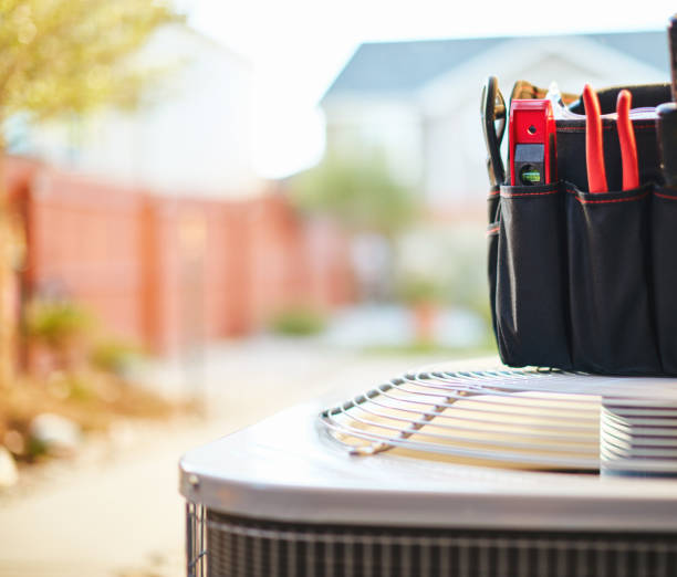 istock Air conditioner with maintenance tools in residential back yard 973631574