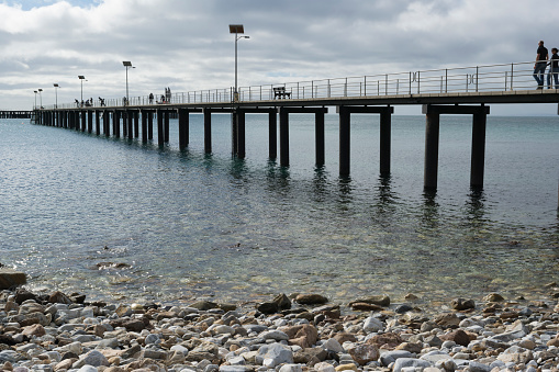 Rapid Bay, South Australia, Australia - May 5, 2018: Tourists and recreational fishermen and women on the new jetty. Part of the Fleurieu Peninsula.