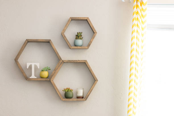 istock Floating hexagon shelves with home decor 973646516