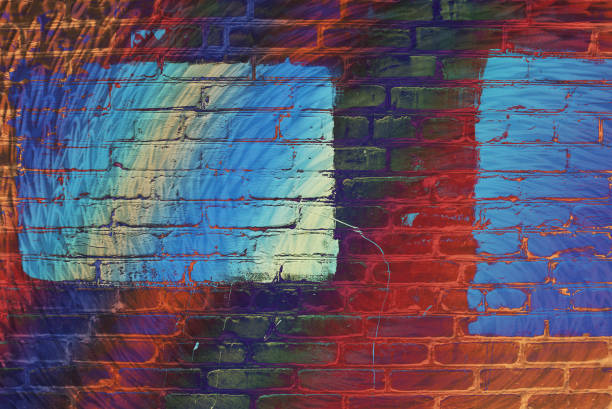 istock Hallucinogen neon surreal brick wall. Exotic fluorescent uneven wall with painted blue glowing center. Big rectangle for mock up in parts close-up. Haunted imagination from drugs and alcohol. 973649384