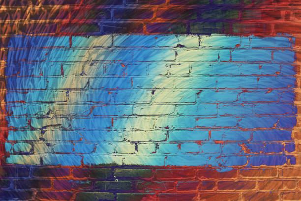 istock Hallucinogen neon surreal brick wall. Exotic fluorescent uneven wall with painted blue glowing center. Big rectangle for mock up in center close-up. Haunted imagination from drugs and alcohol. 973649422